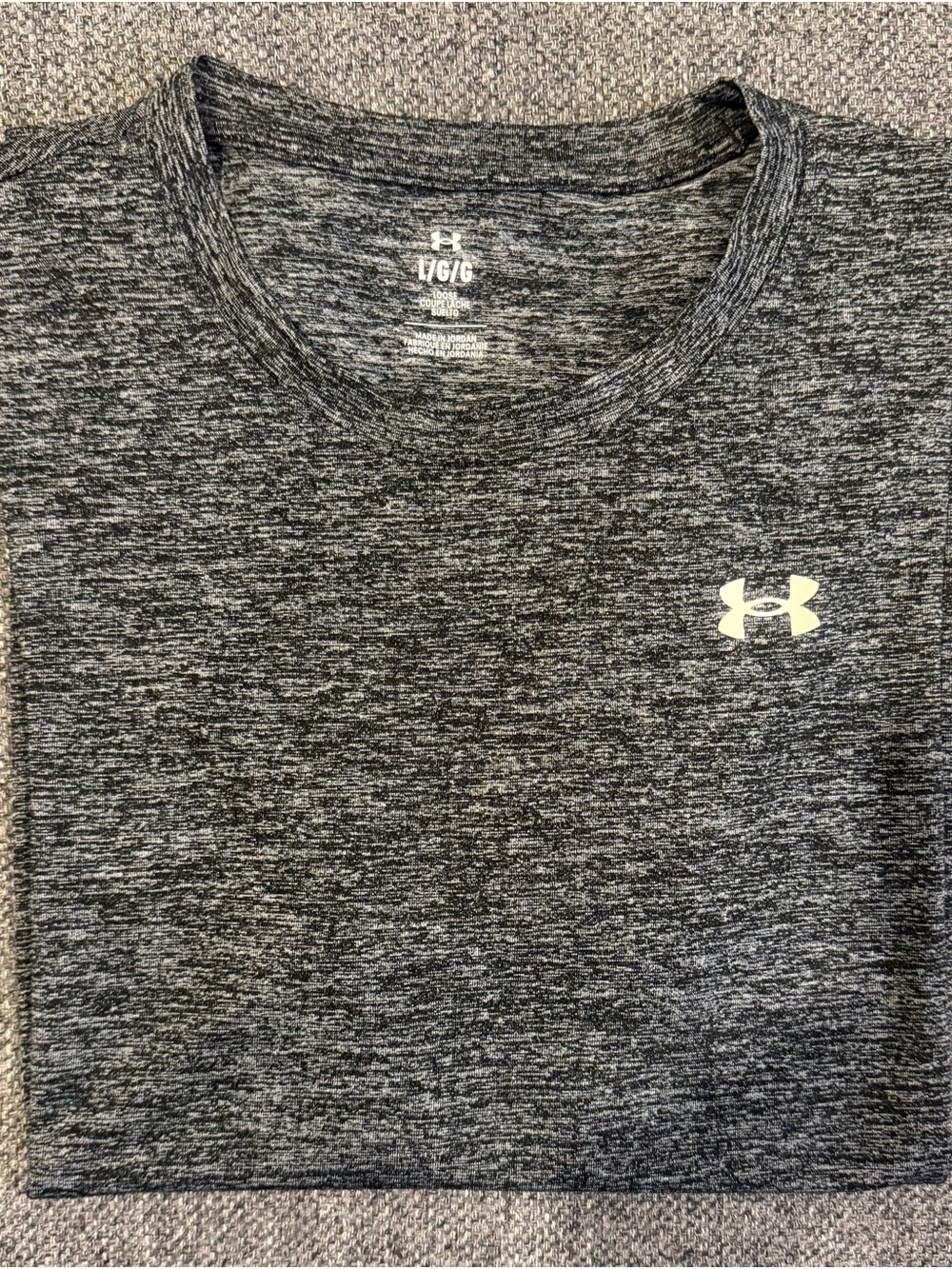 Under Armour Womenโs Black Heathered Performance Short Sleeve Tee